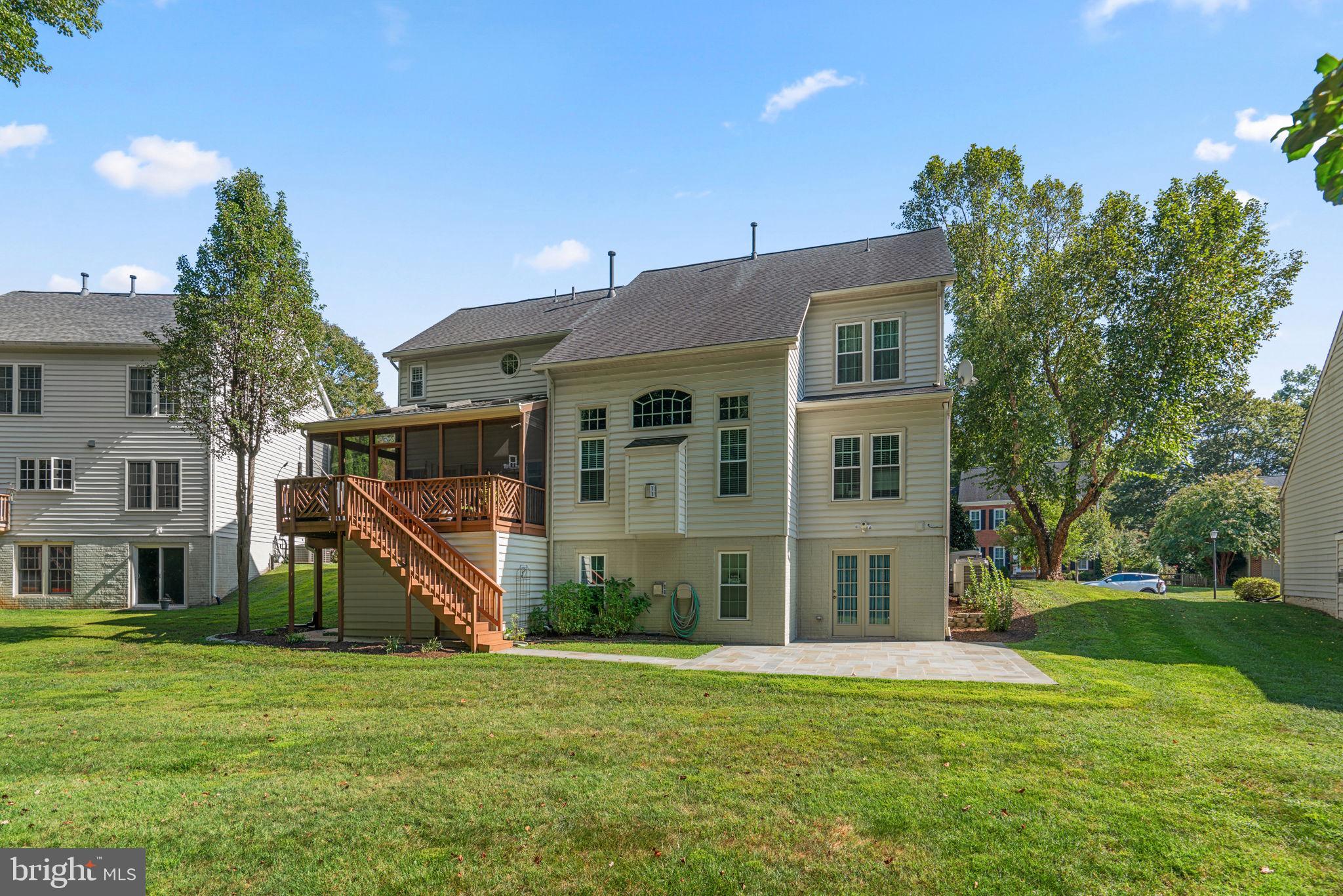4617 Brightwood Road Olney, MD 20832 - Photo 54 of 58 a view of a house next to a big yard and large trees