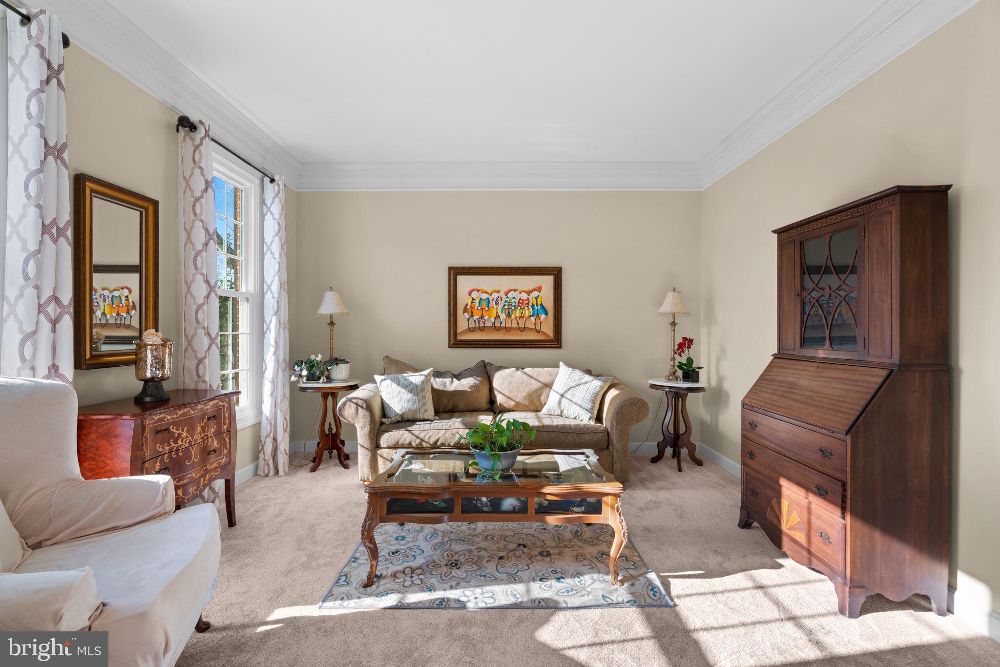 4617 Brightwood Road Olney, MD 20832 - Photo 7 of 58 a living room with furniture and a window