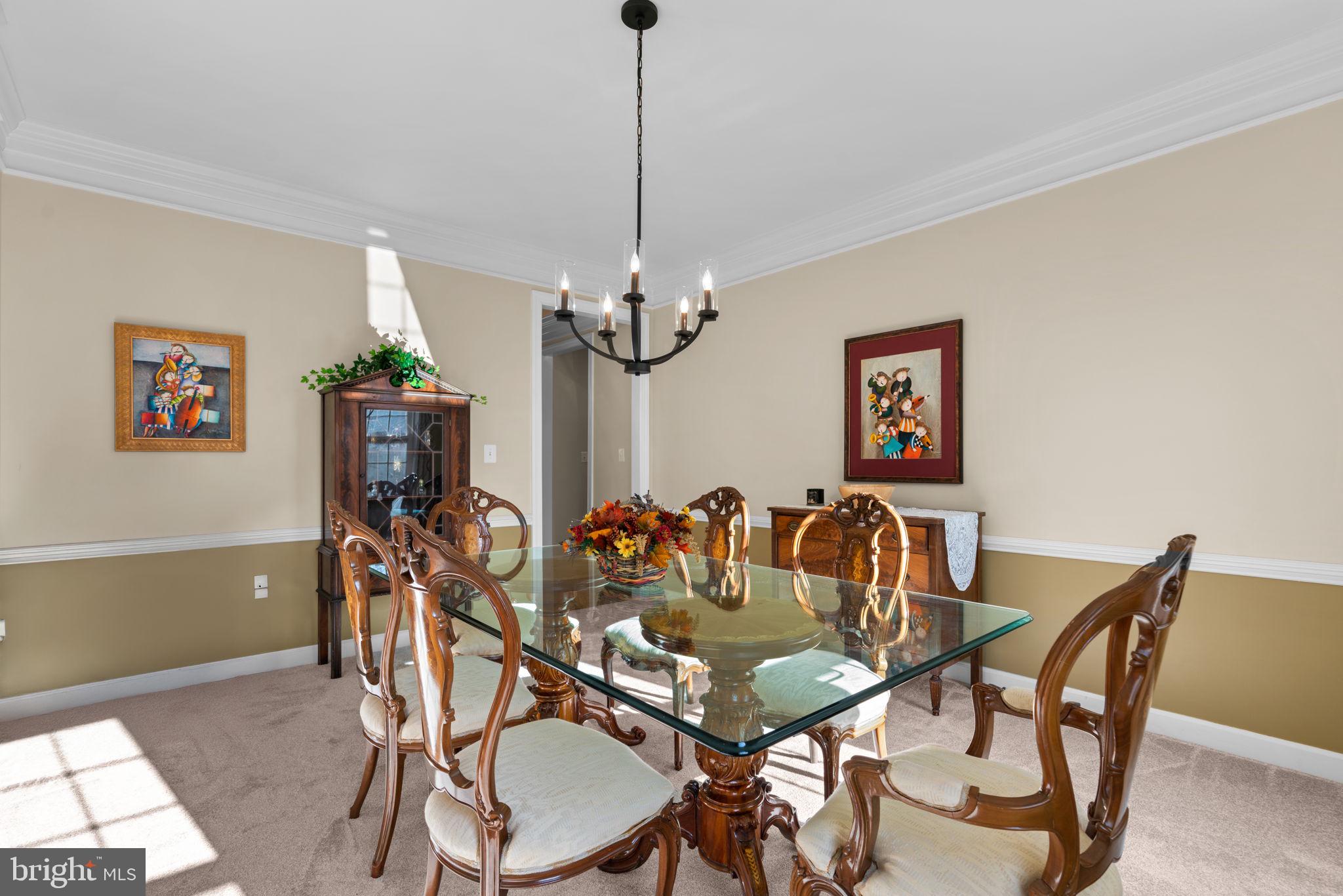 4617 Brightwood Road Olney, MD 20832 - Photo 10 of 58 a view of a dining room with furniture and a chandelier