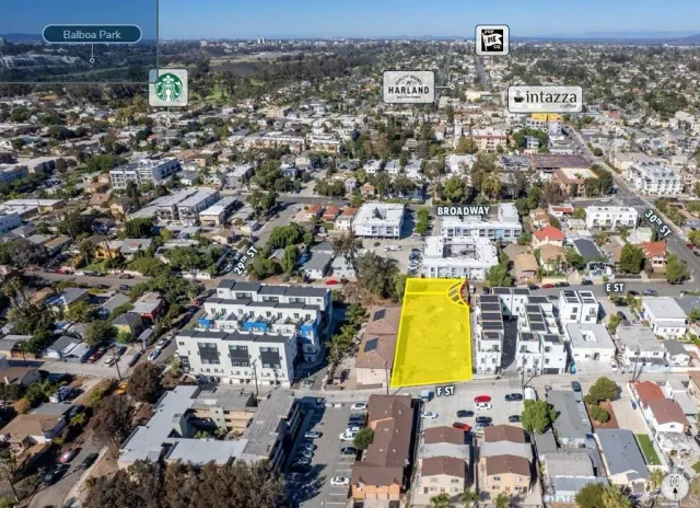 an aerial view of residential building and parking space