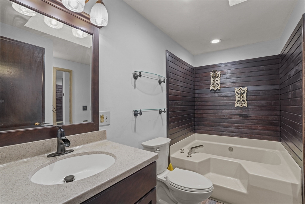 500 Hancock Street Fall River, MA 02721 - Photo 12 of 33 a bathroom with a sink a toilet and bathtub