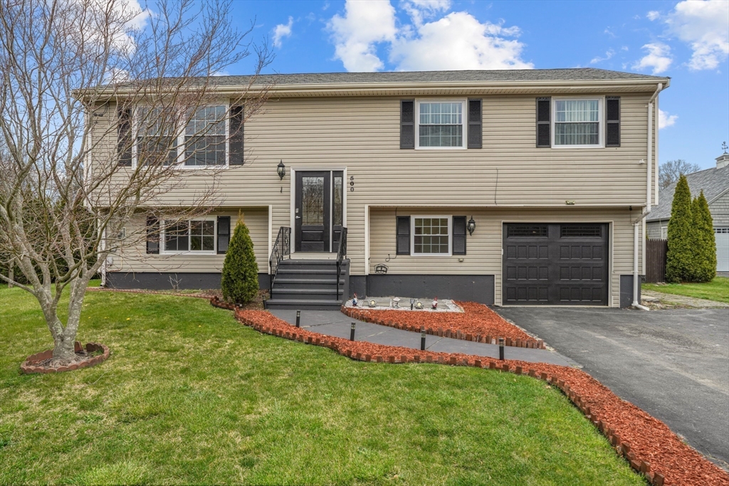 500 Hancock Street Fall River, MA 02721 - Photo 2 of 33 a backyard of a house with seating space