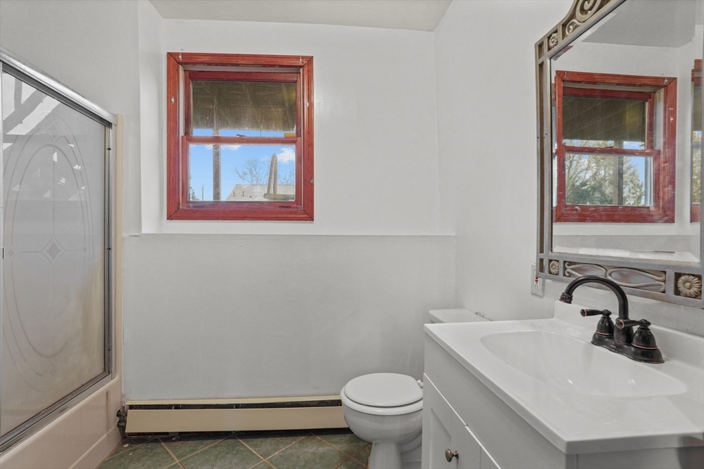 500 Hancock Street Fall River, MA 02721 - Photo 25 of 33 a bathroom with a sink mirror and toilet