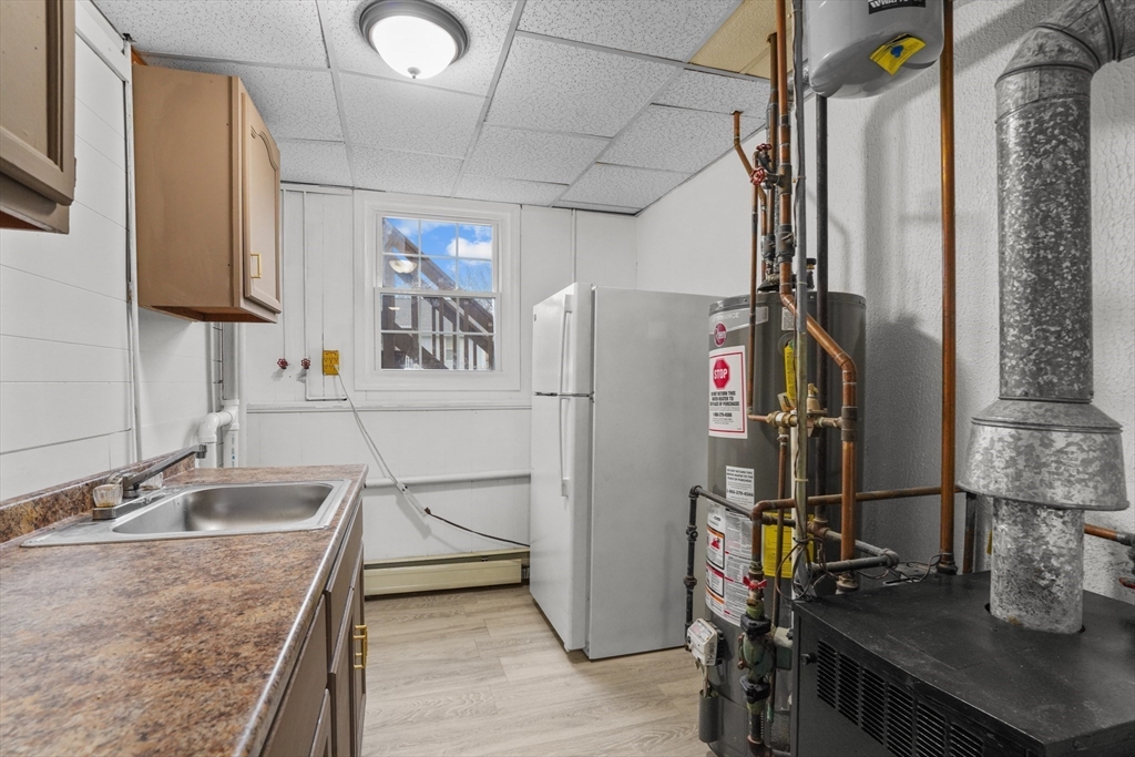 500 Hancock Street Fall River, MA 02721 - Photo 26 of 33 a kitchen with a sink appliances and cabinets