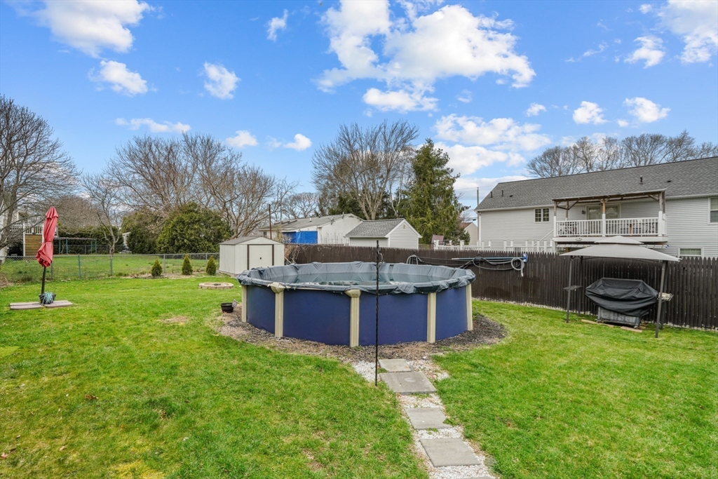 500 Hancock Street Fall River, MA 02721 - Photo 30 of 33 a view of a backyard with a garden and entertaining space