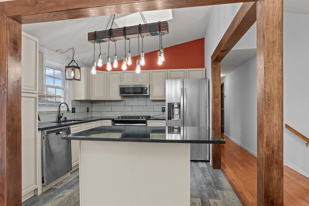 500 Hancock Street Fall River, MA 02721 - Photo 3 of 33 a kitchen with stainless steel appliances a sink and a refrigerator