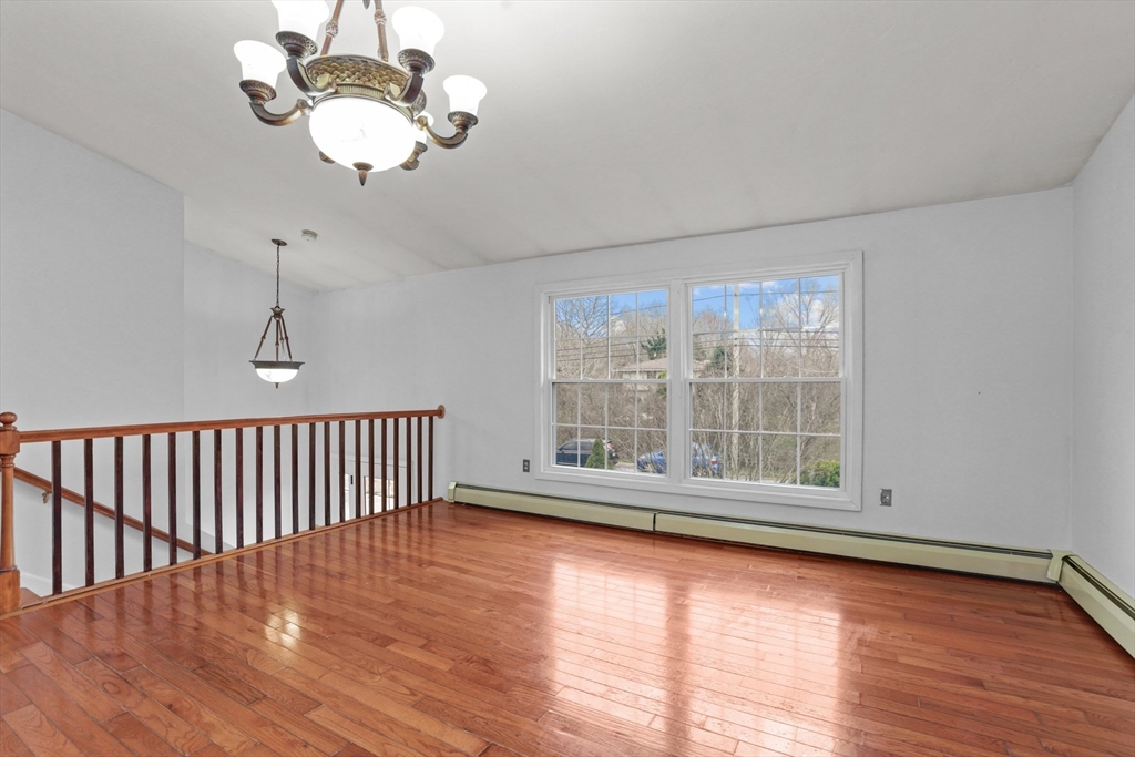 500 Hancock Street Fall River, MA 02721 - Photo 10 of 33 a view of an empty room with wooden floor and windows
