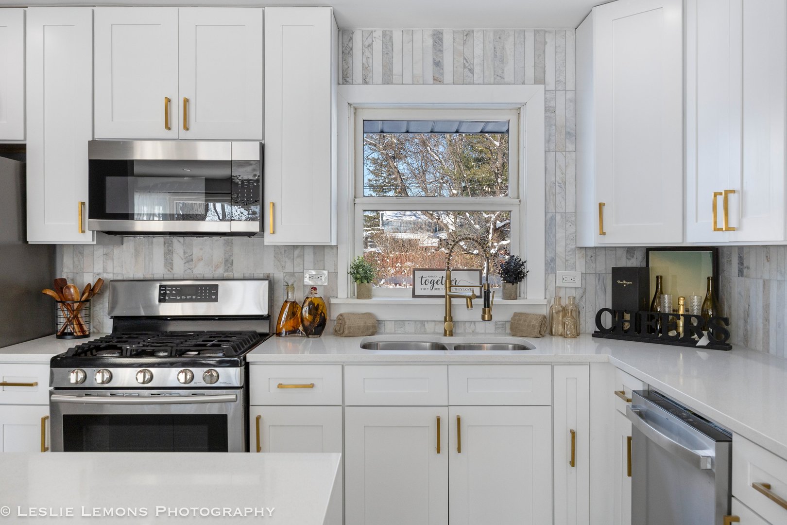 752 Rolling Drive Lisle, IL 60532 - Photo 13 of 37 a kitchen with stainless steel appliances granite countertop a stove a sink and a white cabinets