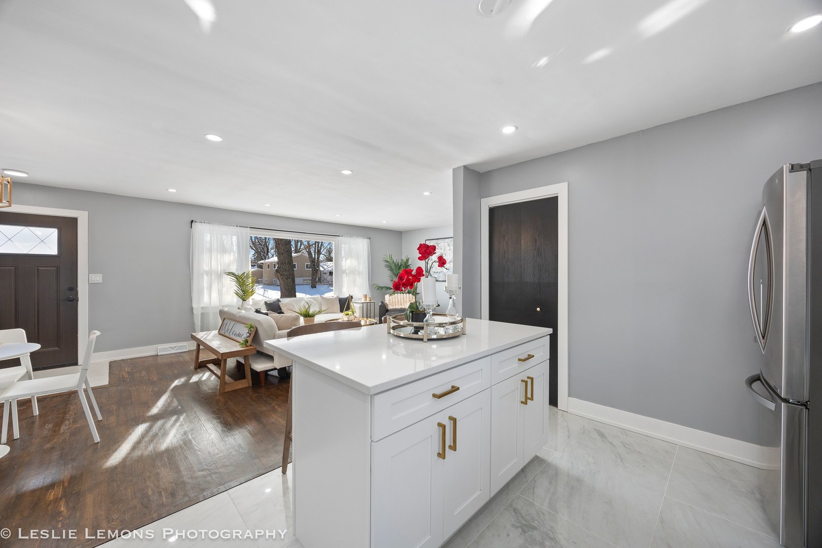 752 Rolling Drive Lisle, IL 60532 - Photo 14 of 37 a kitchen with a sink appliances and living room