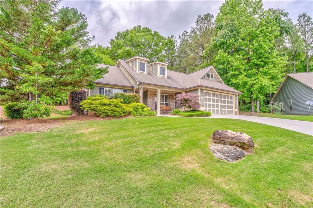 a front view of a house with garden