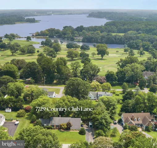 a view of lake with green space
