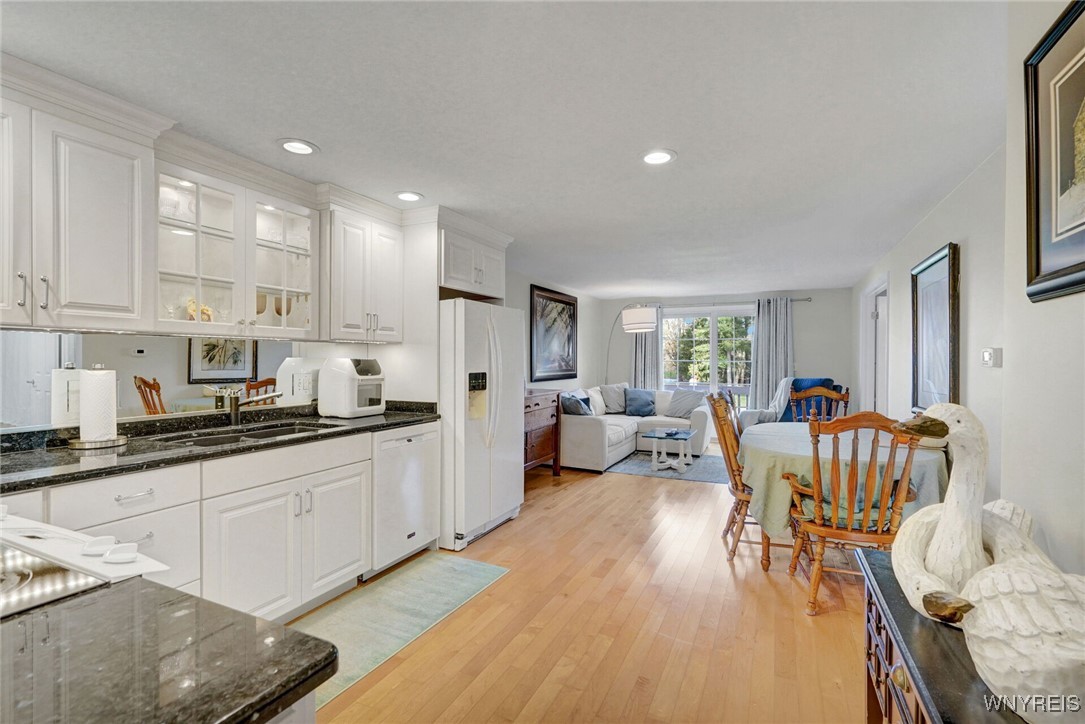 270 Buffalo Road, Unit 86 East Aurora, NY 14052 - Photo 2 of 30 Open kitchen and living room with new cabinetry an