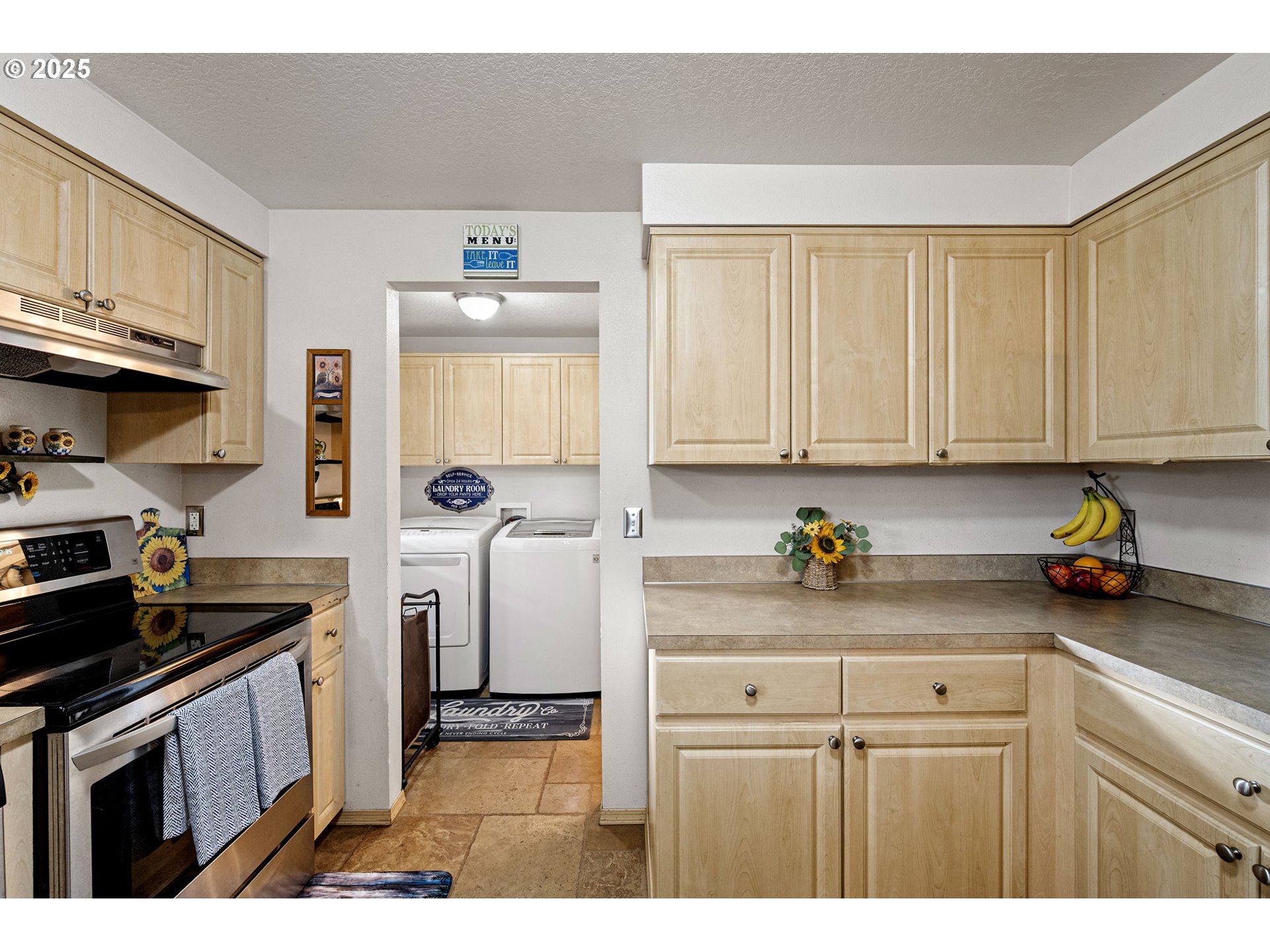 32968 Camas Swale Road Creswell, OR 97426 - Photo 13 of 44 a kitchen with a sink a stove and cabinets