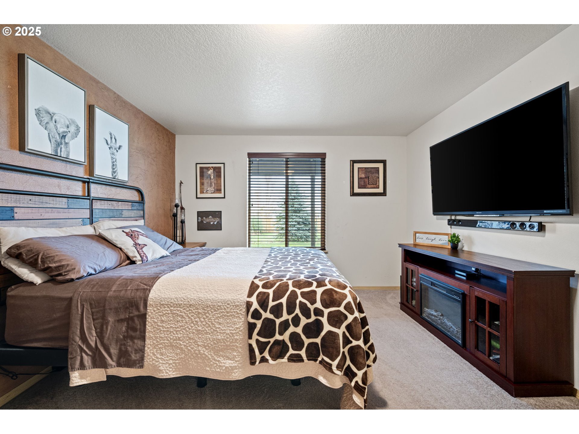 32968 Camas Swale Road Creswell, OR 97426 - Photo 17 of 44 a bedroom with a bed and a flat screen tv
