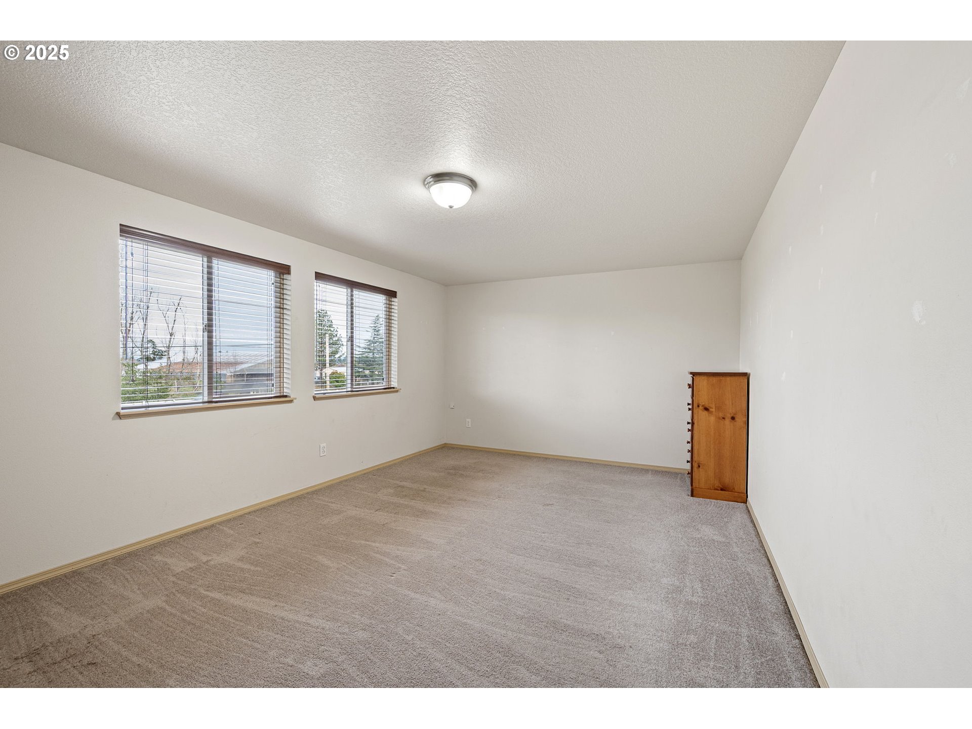 32968 Camas Swale Road Creswell, OR 97426 - Photo 21 of 44 an empty room with windows
