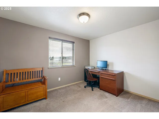 a bedroom with furniture and a window