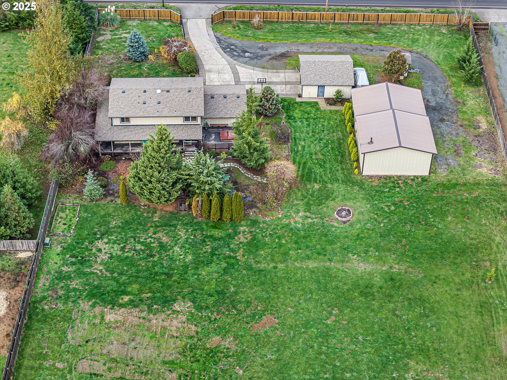 32968 Camas Swale Road Creswell, OR 97426 - Photo 37 of 44 an aerial view of a house with a yard and lake view