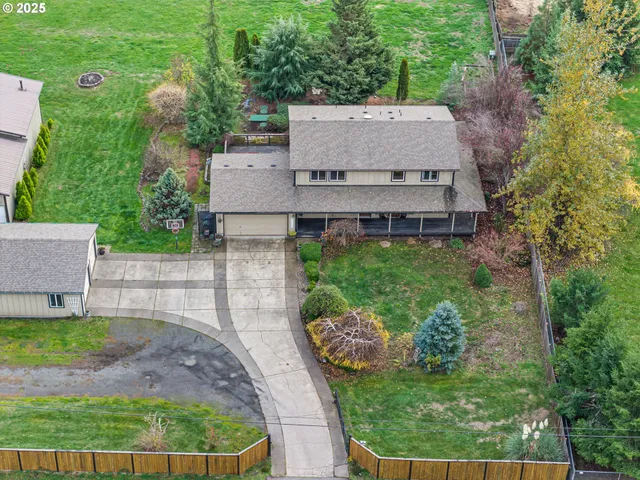 an aerial view of a house with a garden and plants