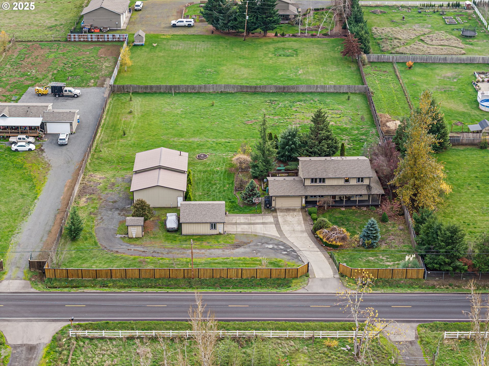 32968 Camas Swale Road Creswell, OR 97426 - Photo 39 of 44 an aerial view of a house with a garden and lake view