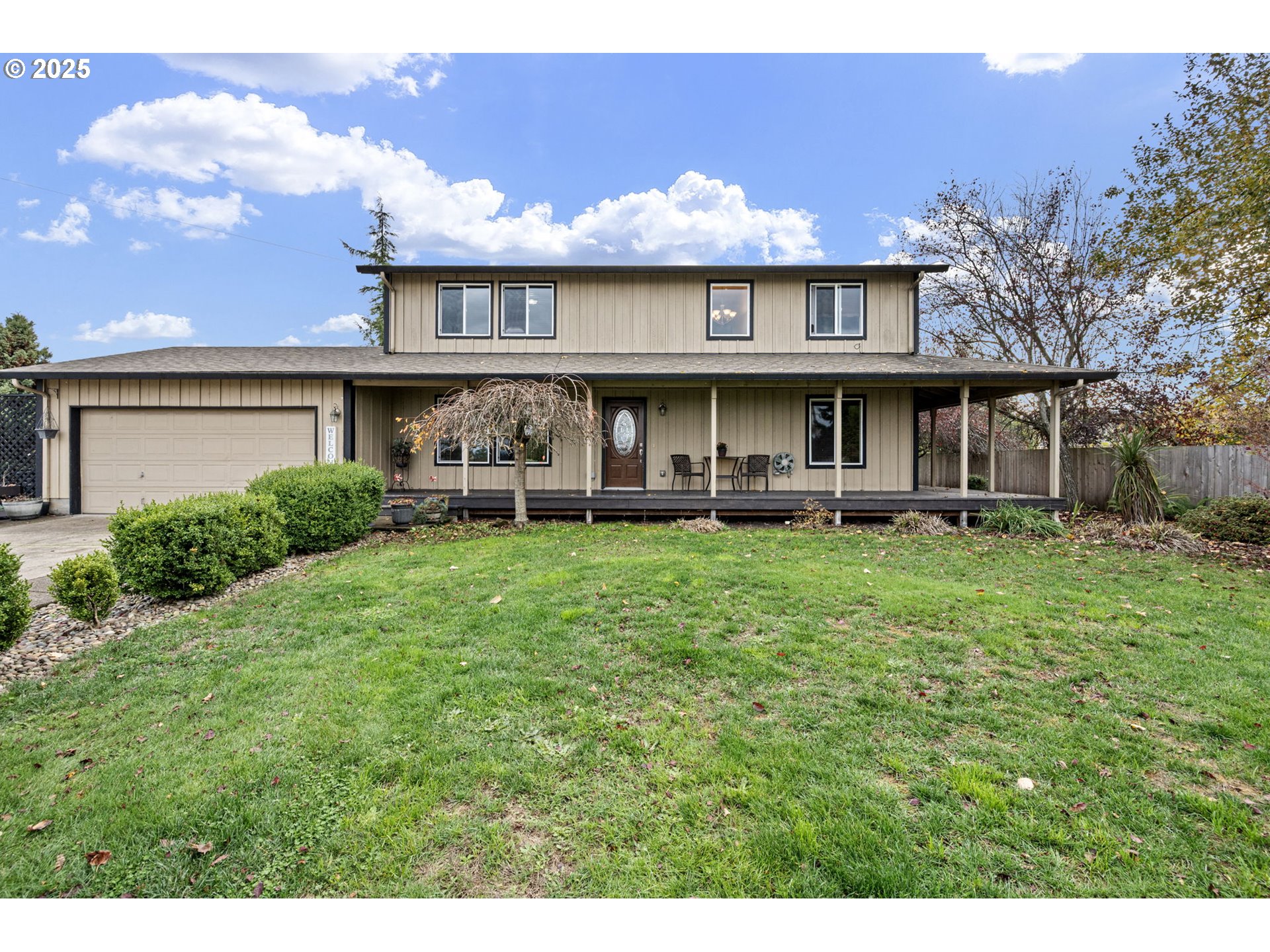 32968 Camas Swale Road Creswell, OR 97426 - Photo 4 of 44 a front view of a house with a yard table and chairs