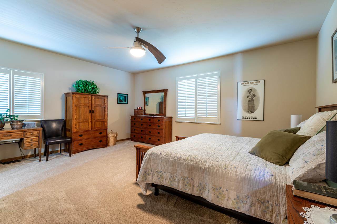 962 Hickory Street Fruita, CO 81521 - Photo 12 of 35 a bedroom with a bed and furniture