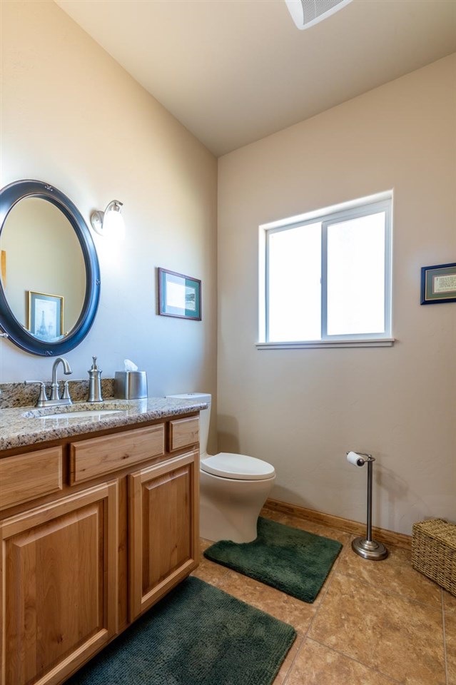 962 Hickory Street Fruita, CO 81521 - Photo 21 of 35 a bathroom with a toilet sink and mirror