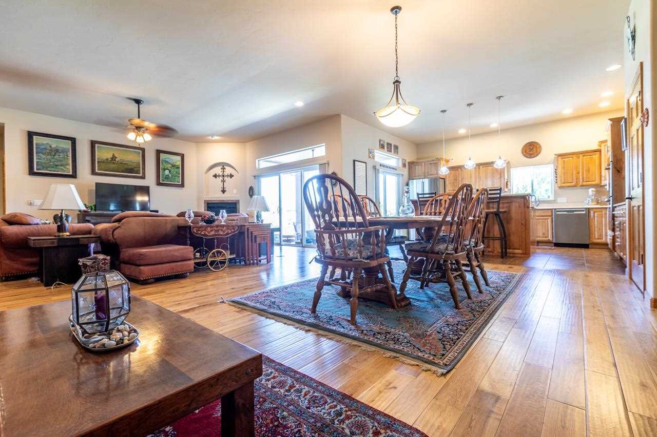 962 Hickory Street Fruita, CO 81521 - Photo 3 of 35 a view of a dining room with furniture window and wooden floor