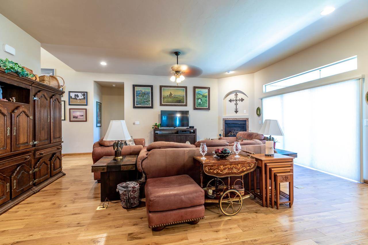 962 Hickory Street Fruita, CO 81521 - Photo 5 of 35 a living room with furniture a window and a flat screen tv