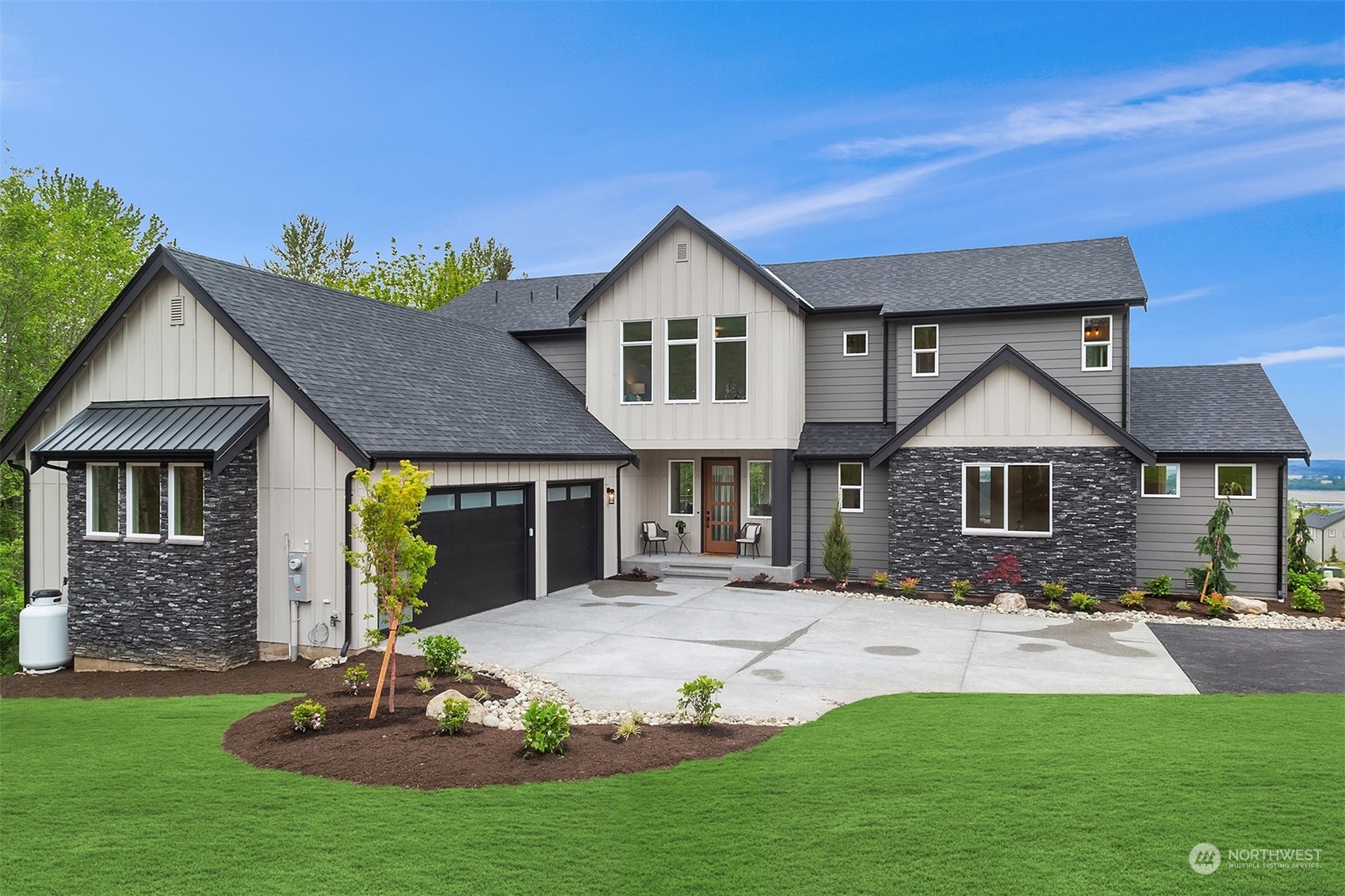 a front view of a house with a yard