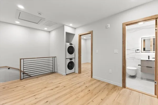 a view of a room with a washer and dryer