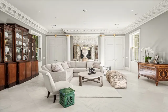 a living room with furniture and window