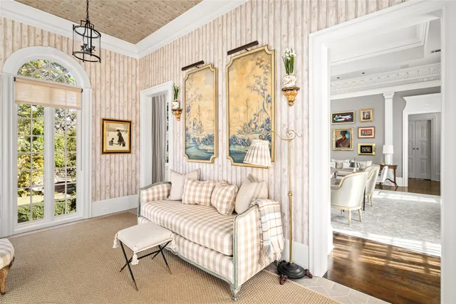a large bathroom with a tub a sink and a large mirror