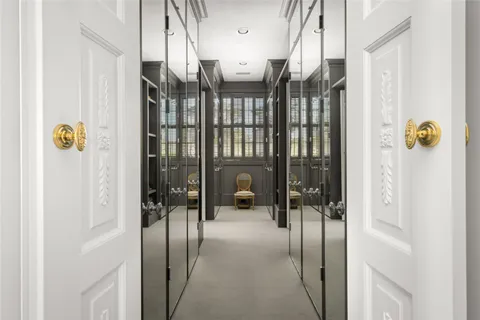 a hallway with a view of living room