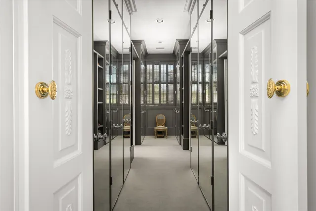 a hallway with a view of living room