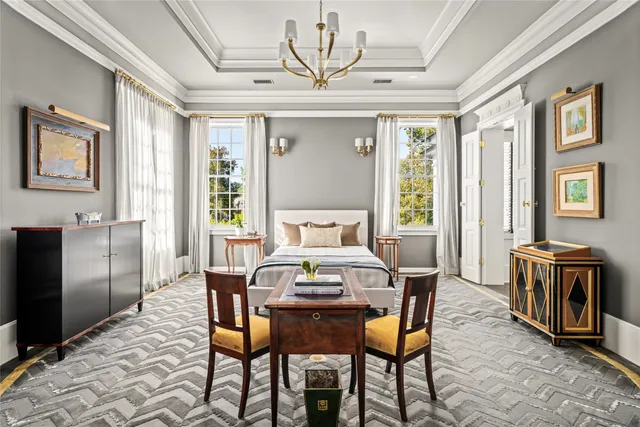 a bedroom with furniture and a book shelf
