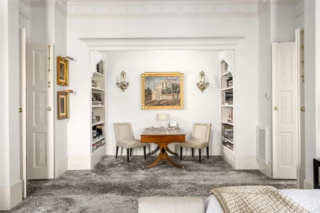 a dining room with a table and chairs