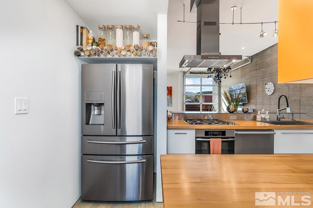 860 South Center Street Reno, NV 89501 - Photo 15 of 36 a kitchen with stainless steel appliances granite countertop a refrigerator and a stove