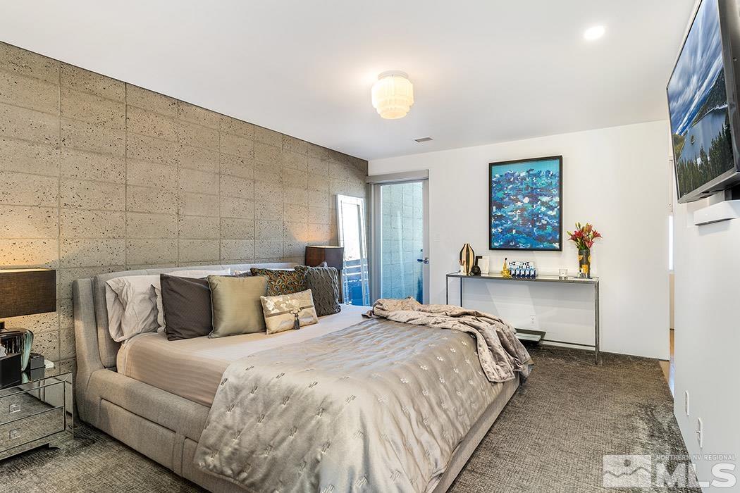 860 South Center Street Reno, NV 89501 - Photo 22 of 36 a bedroom with a bed and painting on the wall
