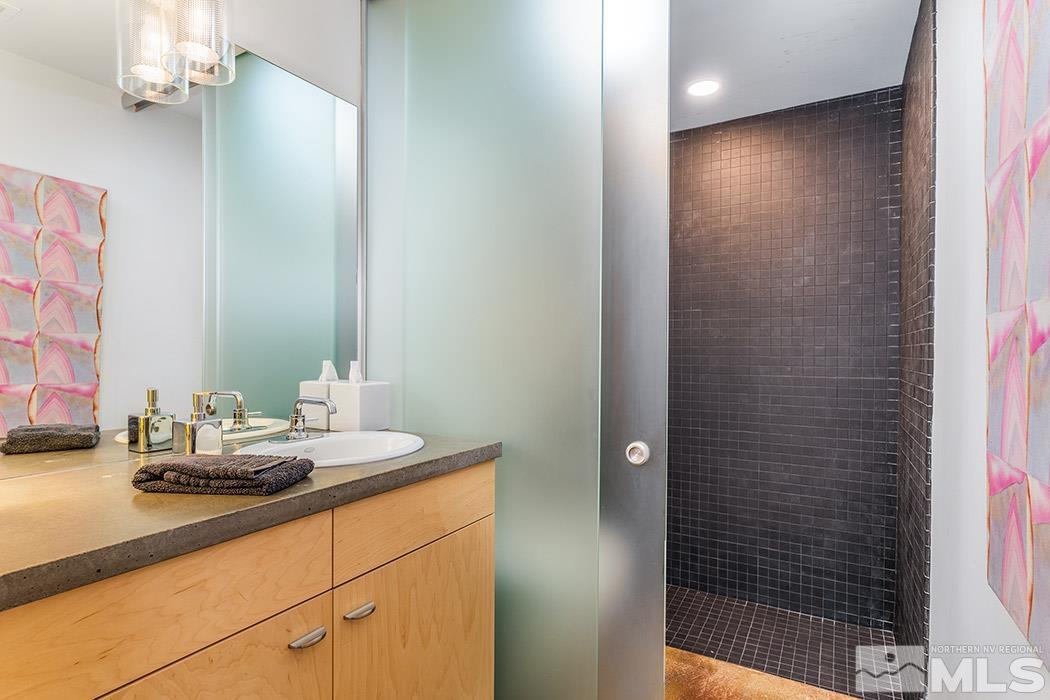 860 South Center Street Reno, NV 89501 - Photo 34 of 36 a bathroom with a sink and a mirror