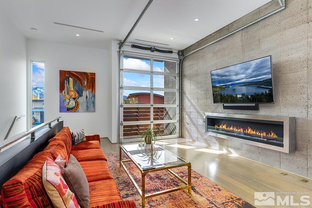 860 South Center Street Reno, NV 89501 - Photo 6 of 36 a living room with furniture a flat screen tv and a fireplace