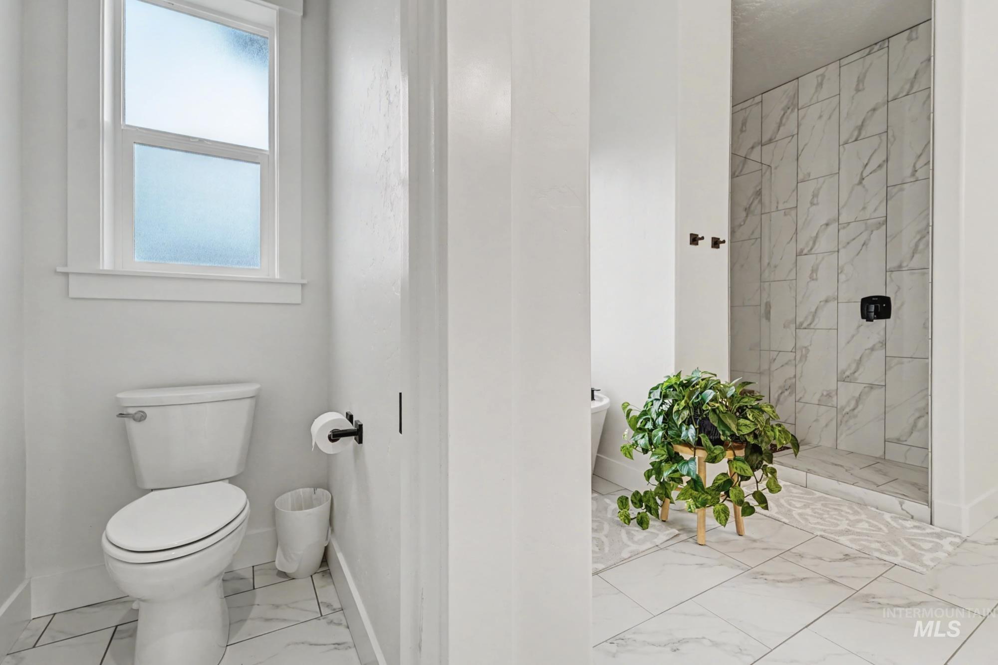 18357 North Burnt Car Way Boise, ID 83714 - Photo 25 of 48 Bathroom with light marble finish flooring and a marble finish shower