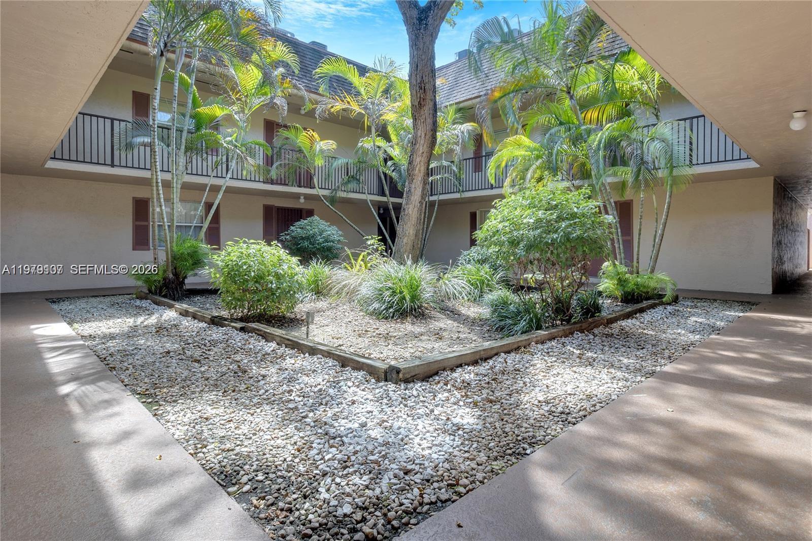 11273 Southwest 88th Street, Unit 114J Miami, FL 33176 - Photo 14 of 19 a view of a backyard