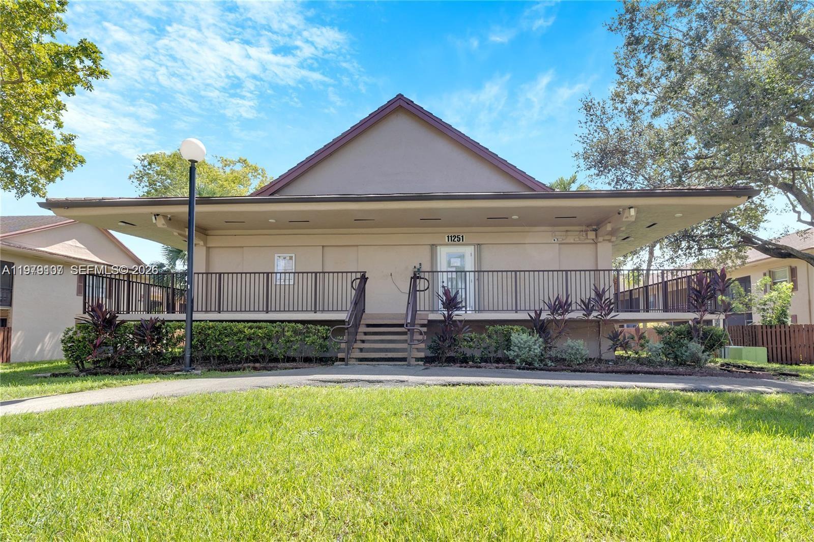11273 Southwest 88th Street, Unit 114J Miami, FL 33176 - Photo 16 of 19 a house view with a outdoor space