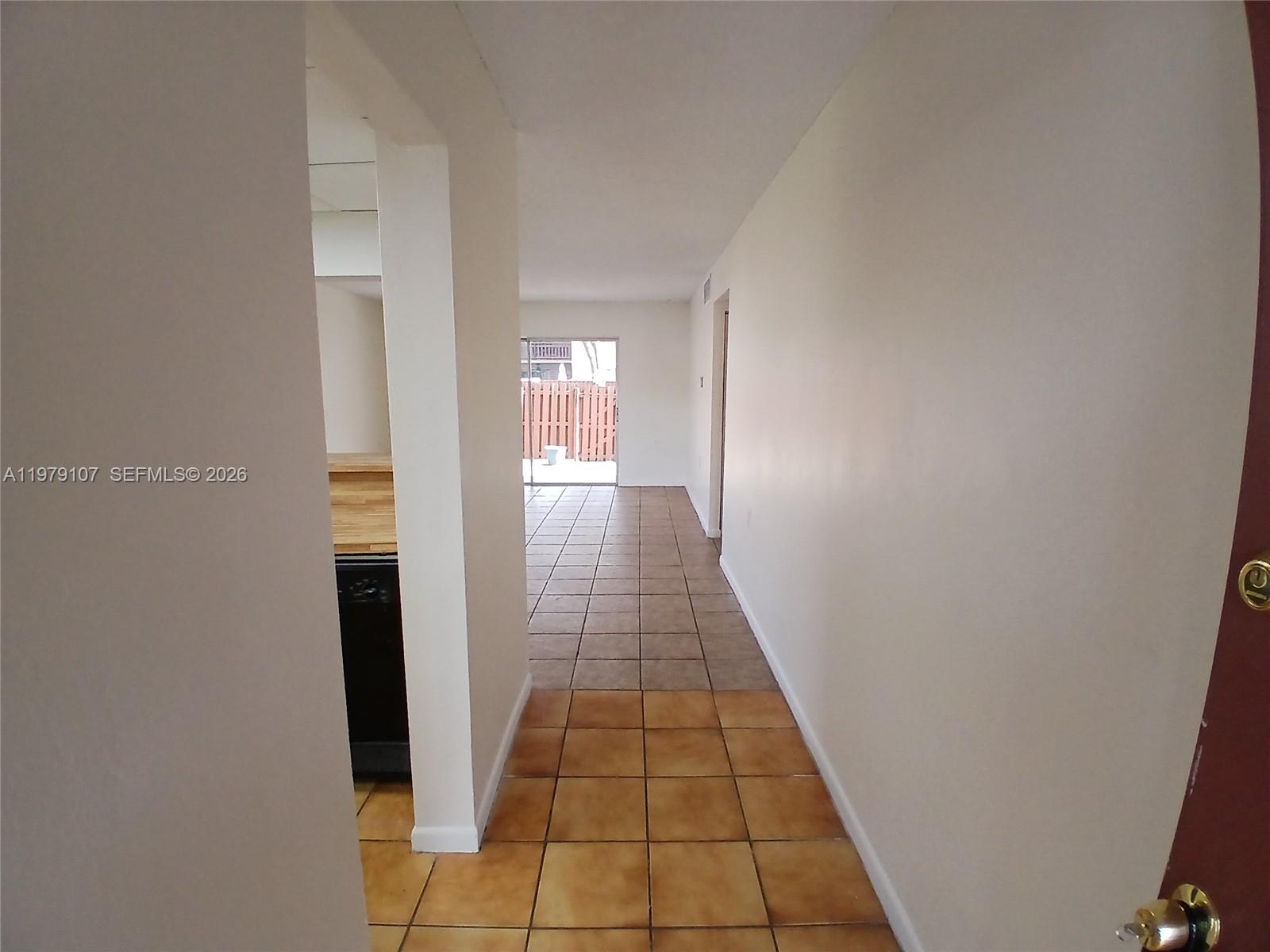 11273 Southwest 88th Street, Unit 114J Miami, FL 33176 - Photo 2 of 19 a view of a hallway with white walls