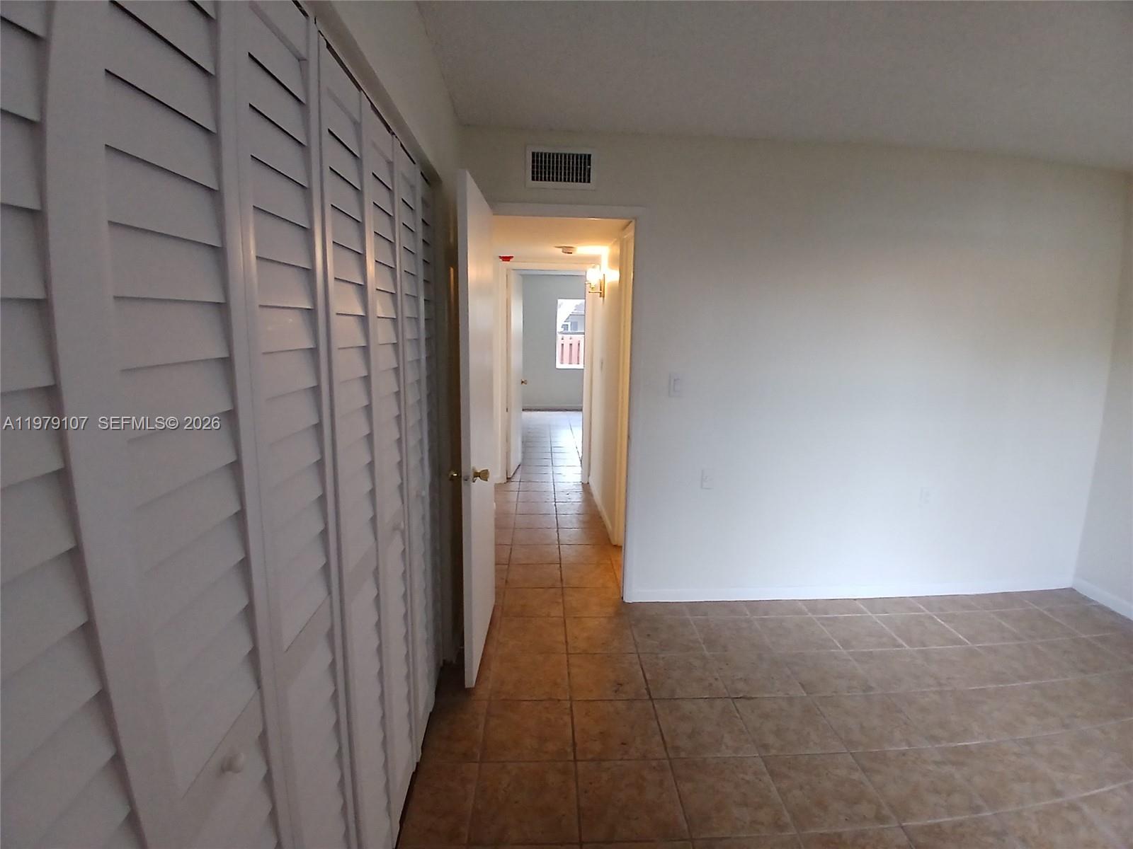 11273 Southwest 88th Street, Unit 114J Miami, FL 33176 - Photo 8 of 19 a view of a hallway