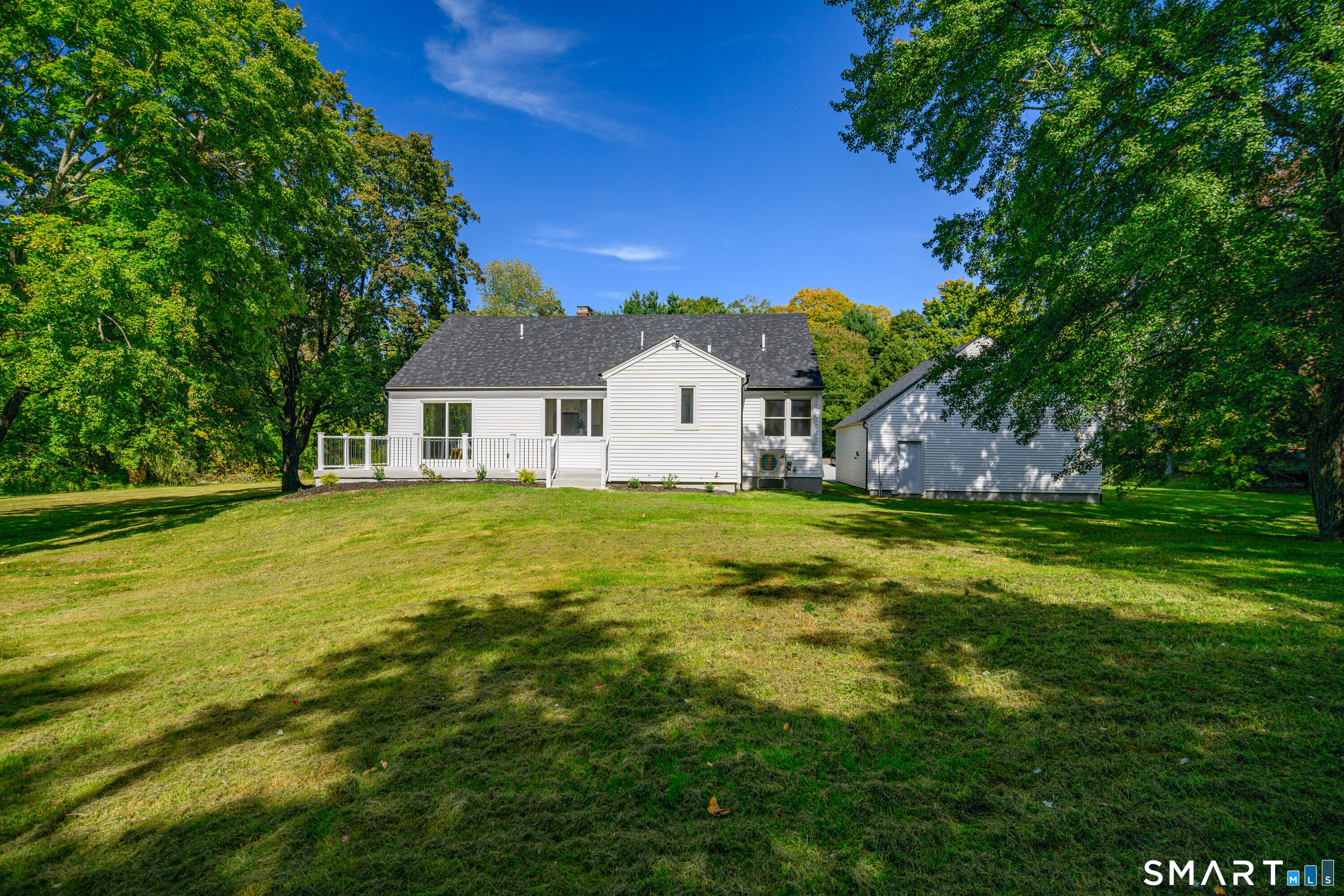34 Rimmon Road Woodbridge, CT 06525 - Photo 34 of 40 Expansive backyard surrounded by mature trees for a private, natural setting.
