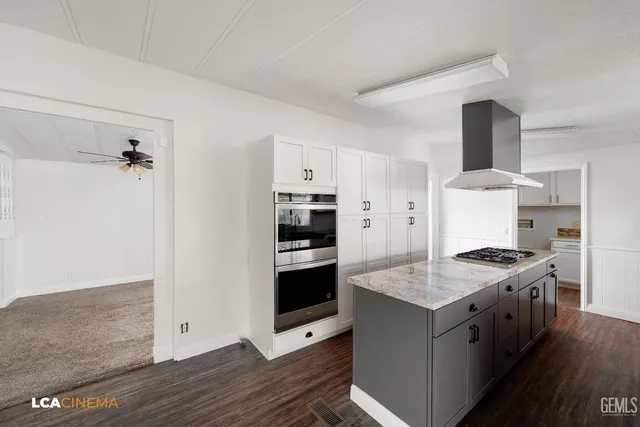 a kitchen with a stove and a refrigerator