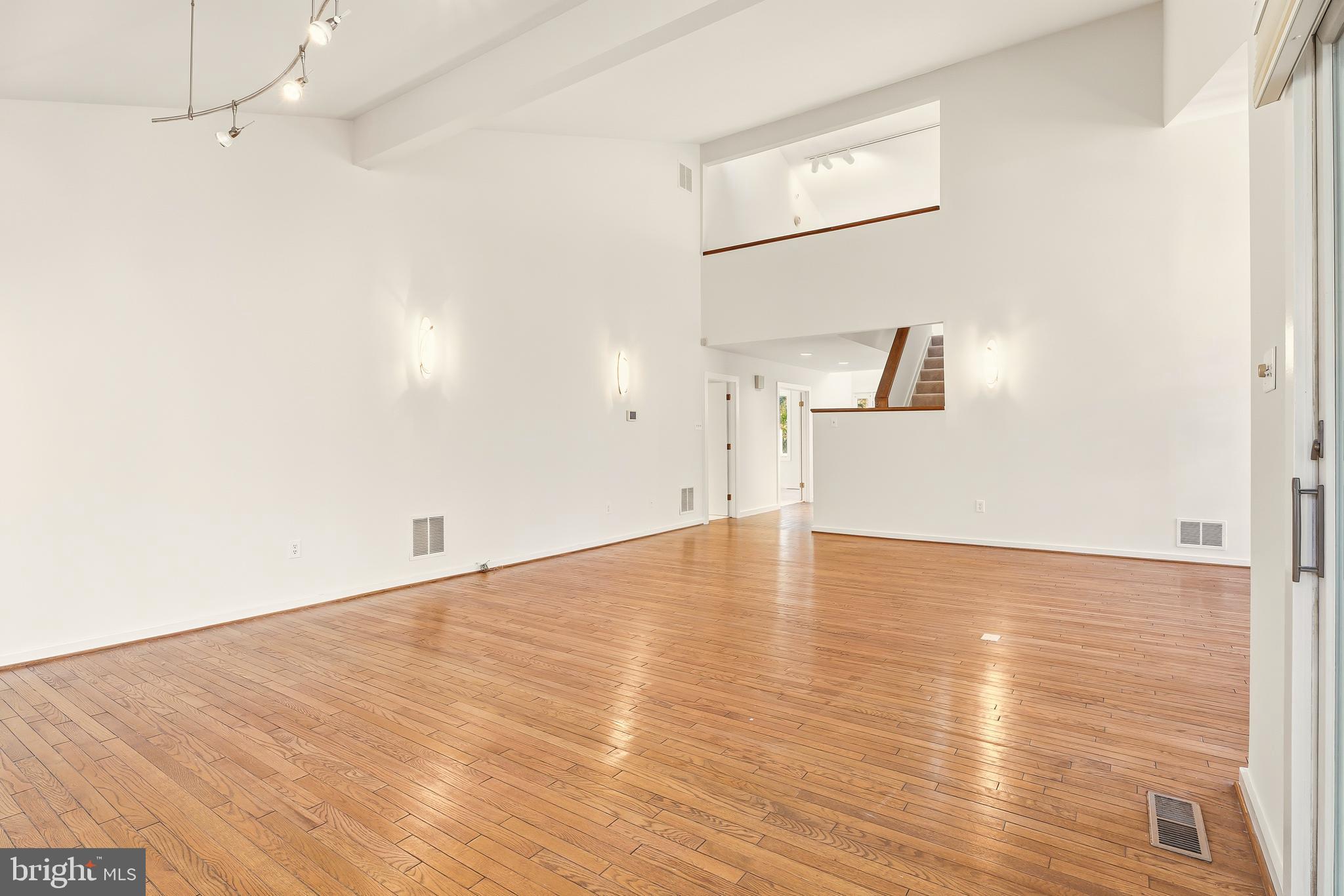 2 Riderwood Station Towson, MD 21204 - Photo 14 of 58 a view of empty room with wooden floor and fan