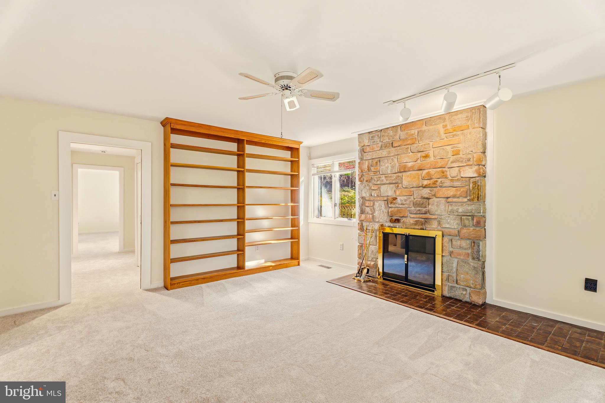 2 Riderwood Station Towson, MD 21204 - Photo 27 of 58 a view of livingroom with furniture fireplace ceiling fan and window
