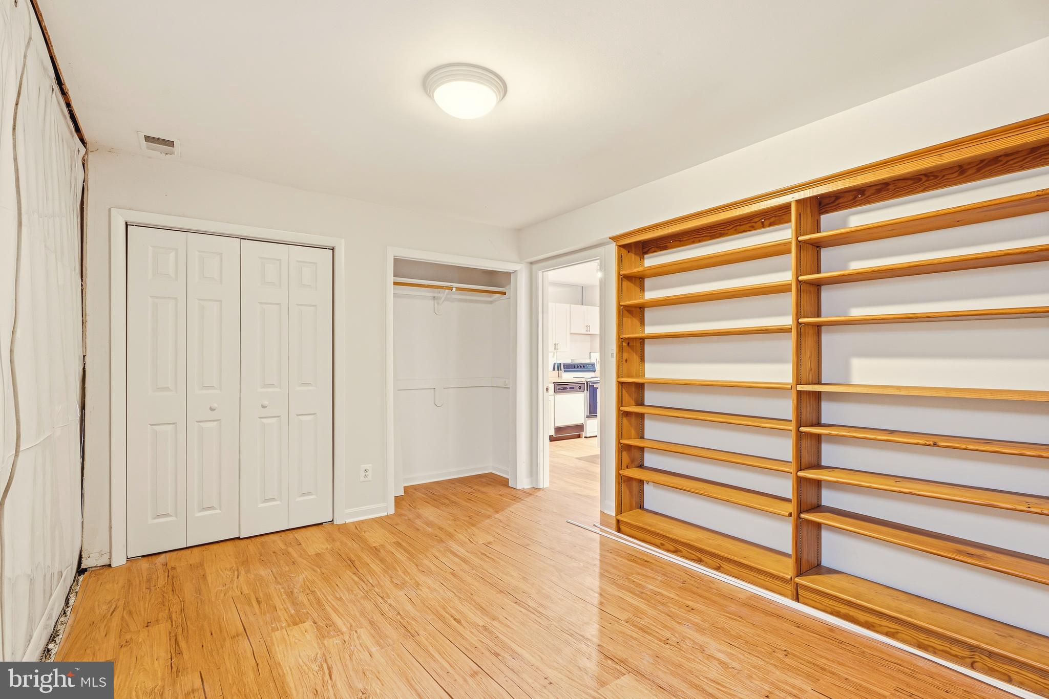 2 Riderwood Station Towson, MD 21204 - Photo 48 of 58 a view of a bedroom with wooden floor and closet